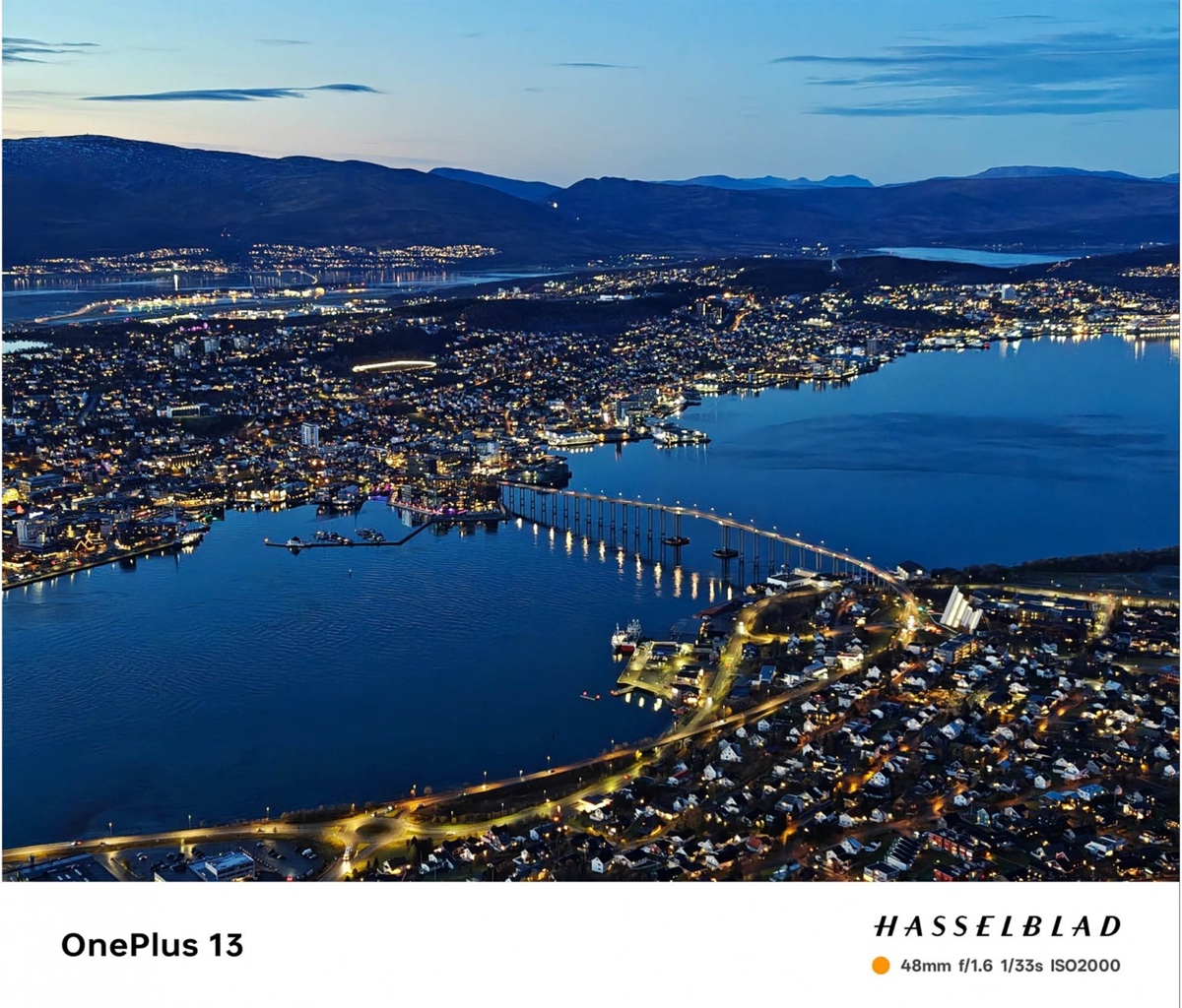 Blue-hour city OnePlus camera sample with Hasselblad footer